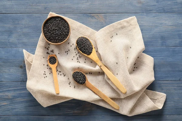 Composition Bowl Spoons Black Sesame Seeds Dark Wooden Background — Stock Photo, Image