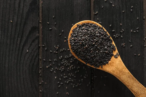 Spoon Black Sesame Seeds Dark Wooden Background Closeup — Stock Fotó