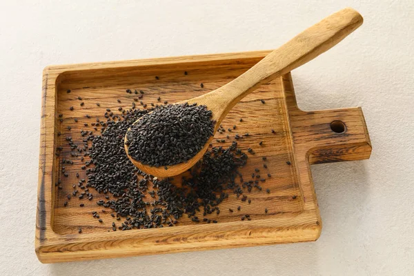 Wooden Board Spoon Black Sesame Seeds Light Background — Stock Fotó