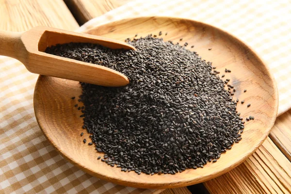 Plate Black Sesame Seeds Wooden Table Closeup — Stockfoto