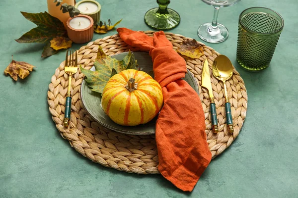 Beautiful Table Setting Autumn Decor Pumpkin Green Background — стоковое фото