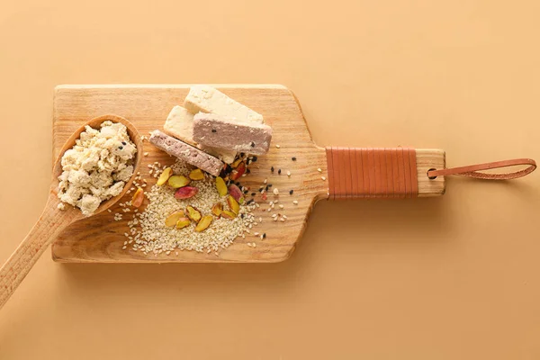 Wooden Board Sweet Sesame Halva Pistachios Color Background — Zdjęcie stockowe
