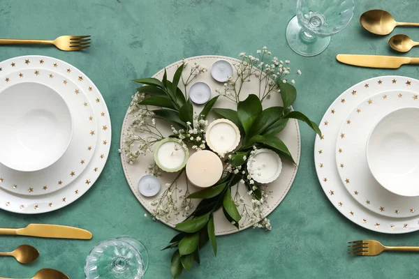 Elegant Table Setting Beautiful Floral Decor Candles Green Background — стоковое фото