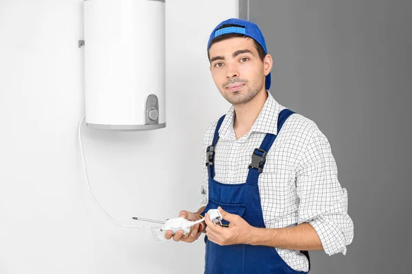 Young Plumber Repairing Boiler Screwdriver Bathroom — 图库照片