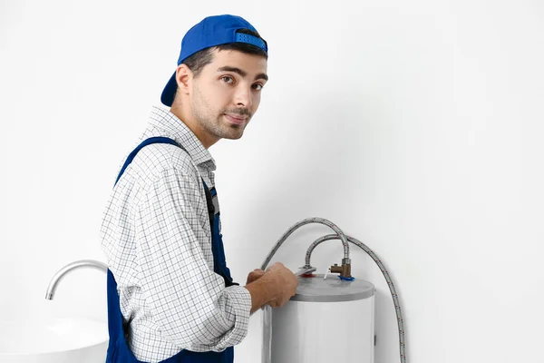 Young Plumber Repairing Boiler Wrench Bathroom — Foto de Stock