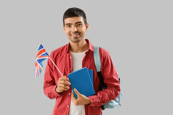 Young Man Flag Books Backpack Grey Background — Stock fotografie