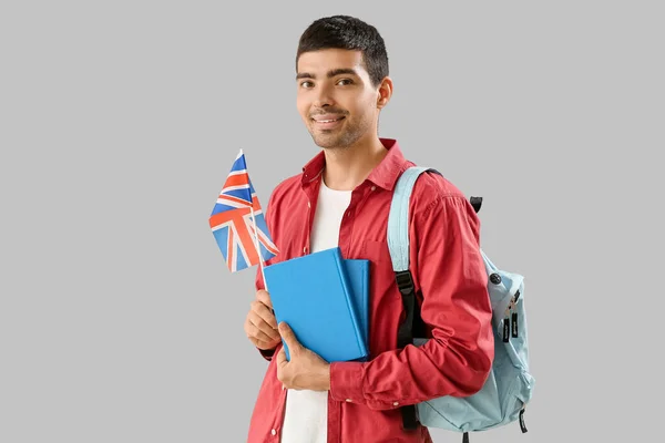Young Man Flag Books Backpack Grey Background —  Fotos de Stock