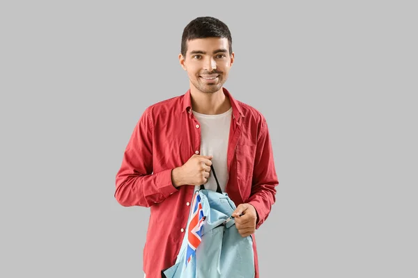 Young Man Flag Backpack Grey Background — Foto de Stock