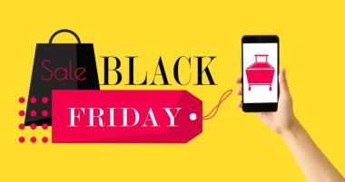 Hand with smartphone and text BLACK FRIDAY SALE on yellow background