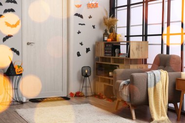 Interior of light living room decorated for Halloween party