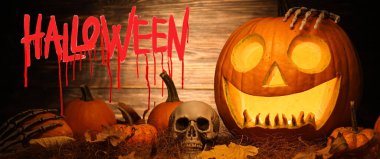 Greeting card for Happy Halloween celebration with pumpkins and human skull