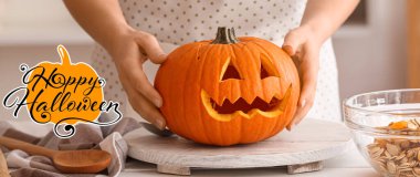 Greeting card for Happy Halloween celebration with woman and carved pumpkin