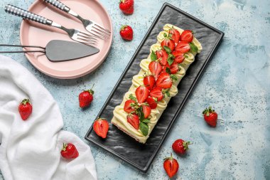 Composition with tasty strawberry roll cake and berries on color background