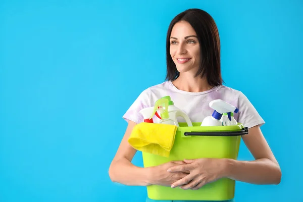 Beautiful Woman Holding Bucket Cleaning Supplies Blue Background — Stockfoto