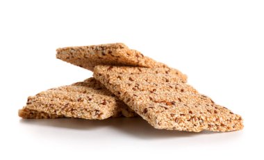 Beyaz arka planda susam tohumlu bir yığın lezzetli kozinaki.