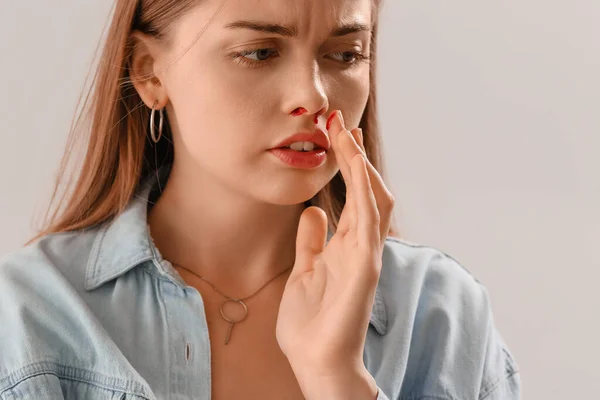 Young Woman Nosebleed Light Background Closeup — Stock Photo, Image