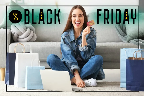 Happy woman with laptop, credit card and shopping bags at home. Black Friday sale