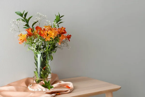 Vase Beautiful Alstroemeria Flowers Pearl Beads Table Light Wall — Zdjęcie stockowe