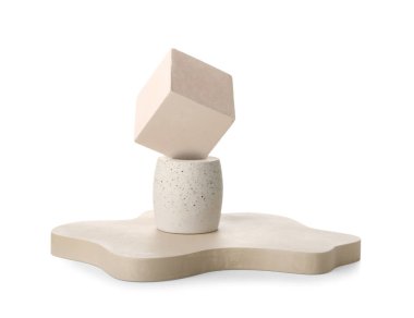 Different decorative podiums for presentation of cosmetic products on white background