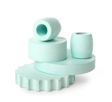 Different decorative podiums for presentation of cosmetic products on white background