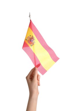 Female hand with flag of Spain on white background