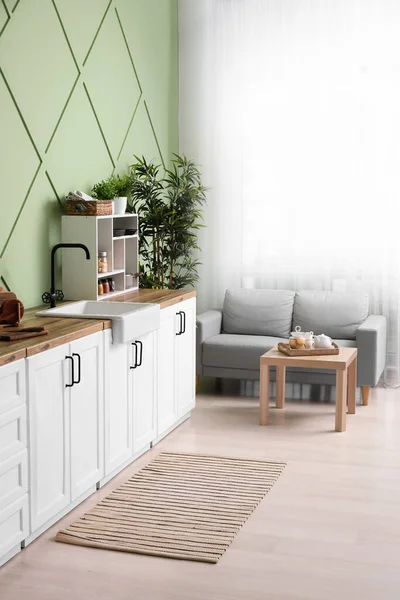 Interior Stylish Kitchen White Counters Sofa Window — Stockfoto