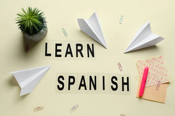 Text Learn Spanish Stationery Flowerpot Paper Planes Beige Background — Stock Photo, Image