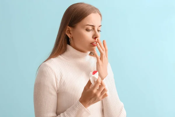 Young Woman Nosebleed Tissue Blue Background — Stock Photo, Image