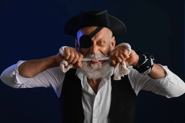 Angry old pirate with rope on dark background