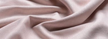 Açık bej kumaşın dokusu, yakın plan.