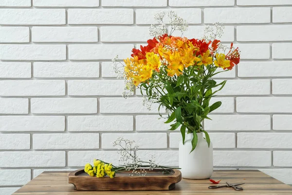 Vase Beautiful Alstroemeria Flowers Scissors Table White Brick Wall — Stock Photo, Image