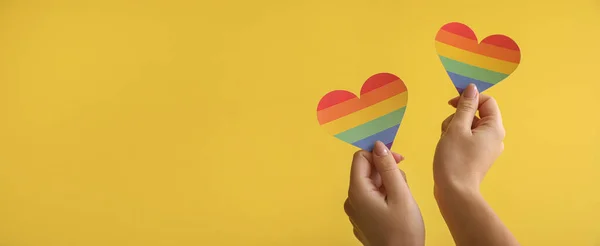 Female Hands Holding Rainbow Hearts Yellow Background Space Text Lgbt — Stock Photo, Image