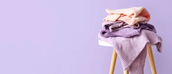 Stack Warm Sweaters Table Lilac Background Space Text —  Fotos de Stock