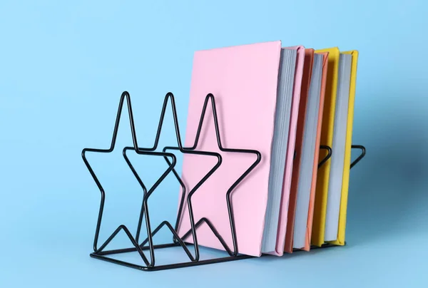 Black Metal Holder Books Blue Background — Fotografia de Stock