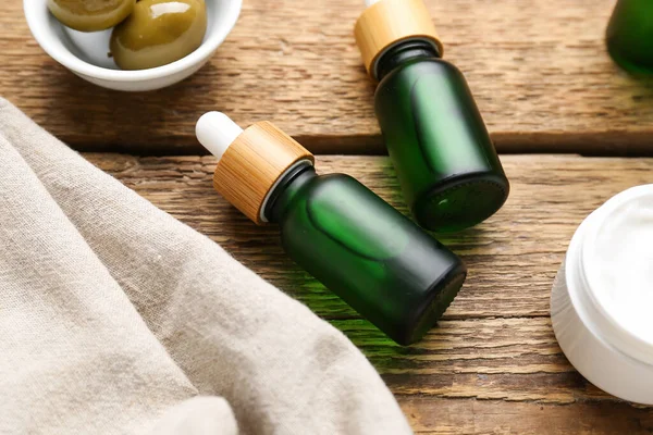 Bottles Olive Essential Oil Wooden Table Closeup — Stock Photo, Image