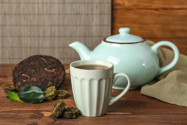 Dry Pressed Puer Tea Cup Wooden Table Closeup — Stock Photo, Image