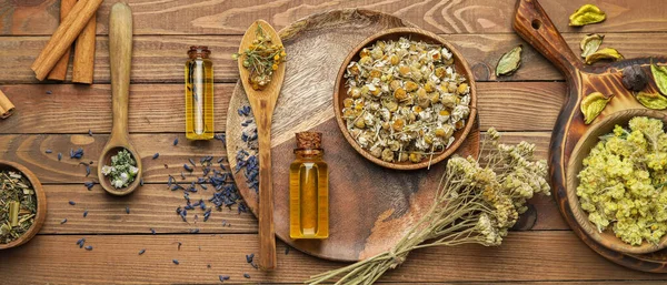 Composition Dry Herbs Bottles Essential Oil Wooden Background Top View — Stock Photo, Image