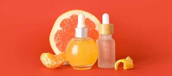 Bottles Citrus Essential Oil Red Background — Stock Photo, Image