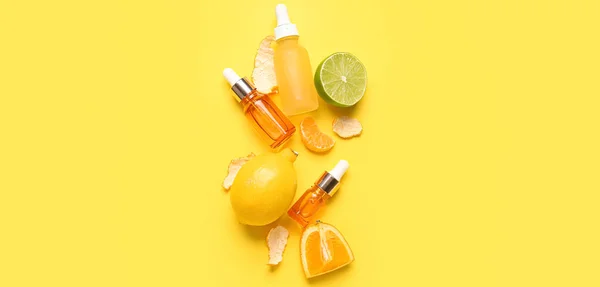 Composition Bottles Citrus Essential Oil Fruits Yellow Background — Stock Photo, Image