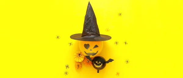 Composition with Halloween balloons, witch's hat and pumpkins on yellow background