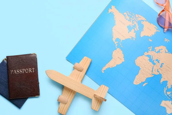 World Map Passports Wooden Plain Blue Background Closeup — Stock Photo, Image