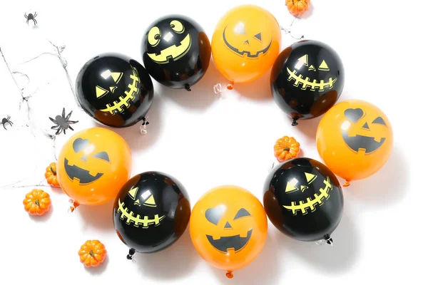 Frame made of Halloween balloons on white background