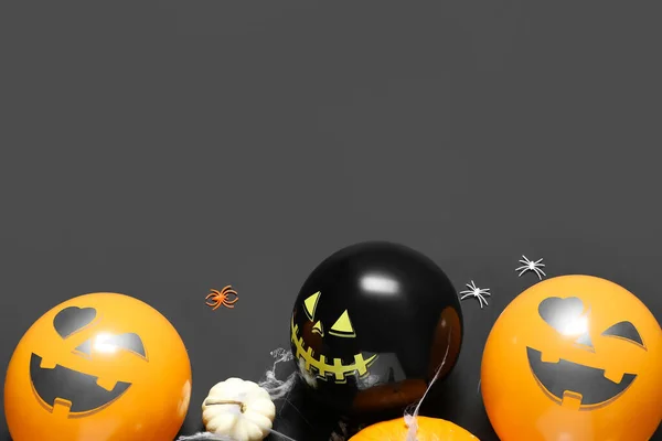 Funny Halloween balloons on dark background