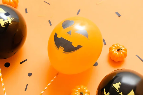 Balloons for Halloween party on color background, closeup