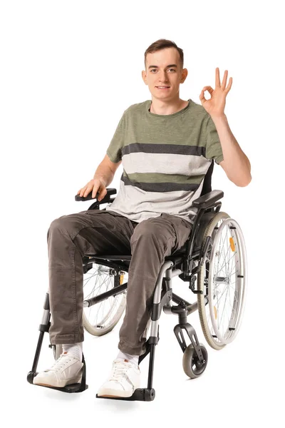 Młody Mężczyzna Wózku Inwalidzkim Pokazuje Białym Tle — Zdjęcie stockowe