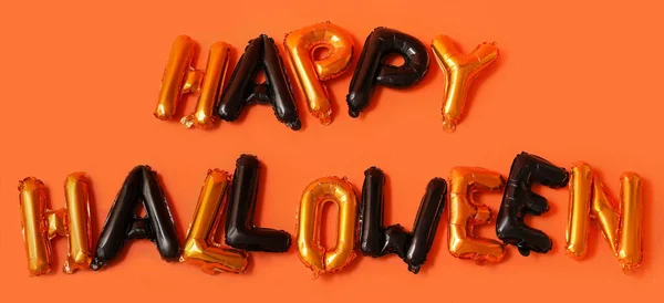 用橙色背景的气球制成的Happy哈洛什语 — 图库照片