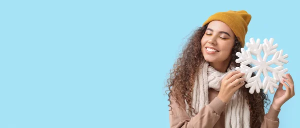 Beautiful African American Woman Holding Big Snowflake Light Blue Background — Stock Photo, Image