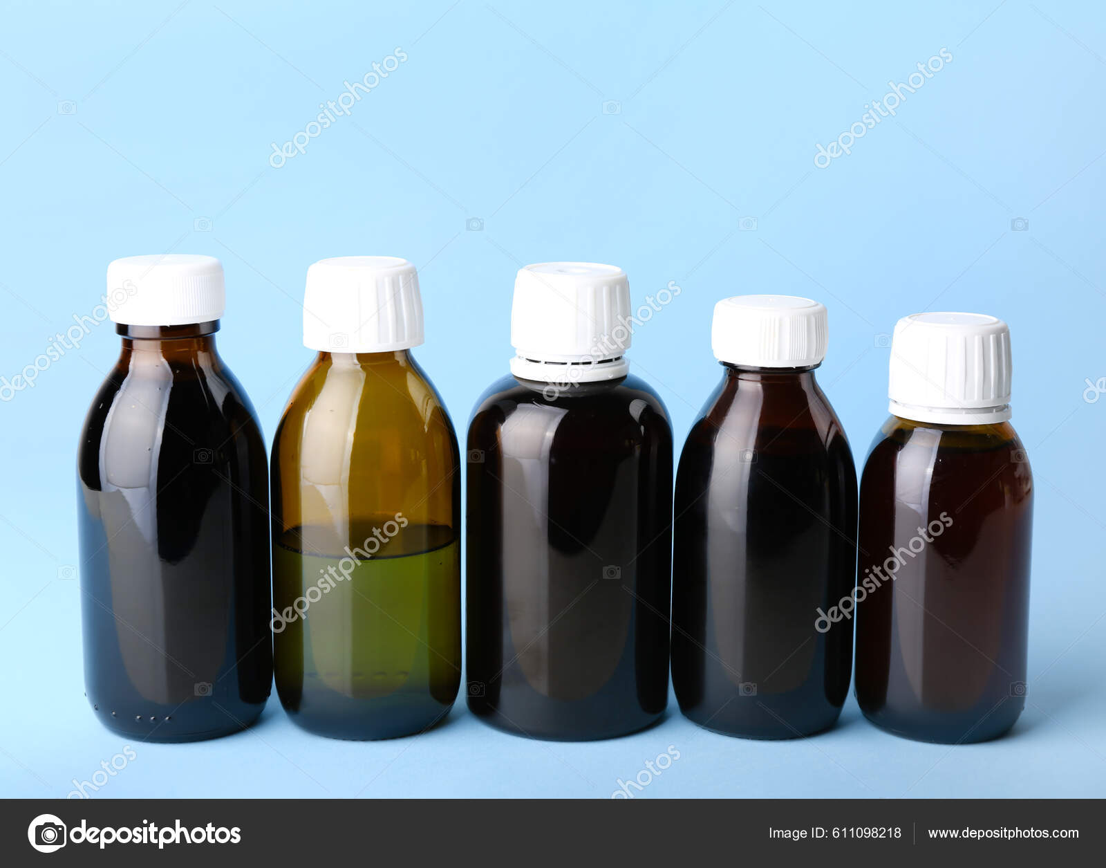 Bottles Cough Syrup Blue Background Stock Photo by ©serezniy 611098218