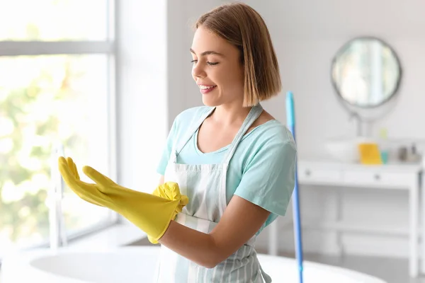 Young Housewife Putting Rubber Glove Bathroom — Stock Photo, Image