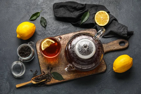 Board Glass Cup Black Tea Lemons Teapot Dark Background — Stock Photo, Image